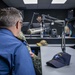 Lt. Cmdr. Allan Wilson Conducts a Radio Interview