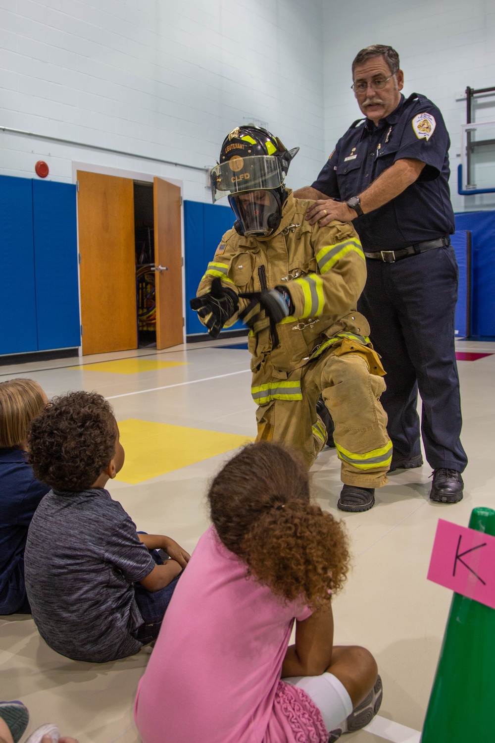 Firefighters teach fire prevention to students through song and dance