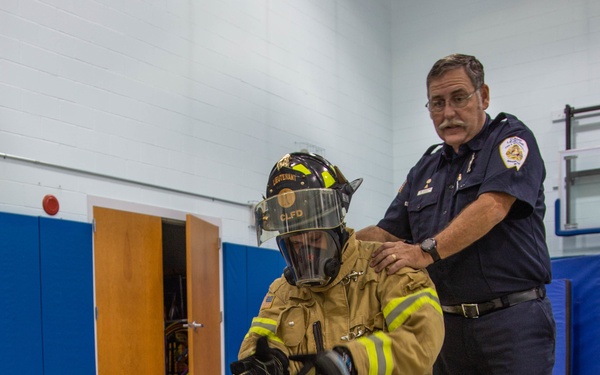 Firefighters teach fire prevention to students through song and dance
