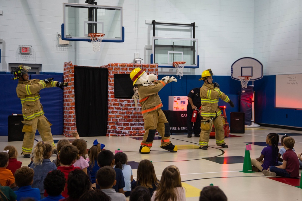 Firefighters teach fire prevention to students through song and dance