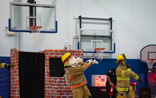 Firefighters teach fire prevention to students through song and dance