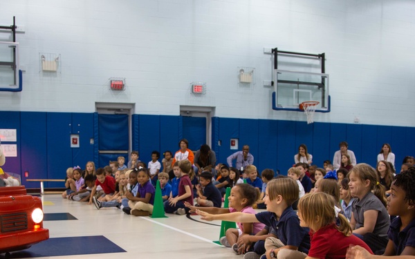 Firefighters teach fire prevention to students through song and dance