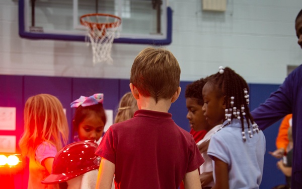 Firefighters teach fire prevention to students through song and dance