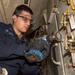 USS Normandy Sailor Removes Paint from Gas Turbine Generator Module