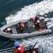 RHIB Transits Beside USS Normandy