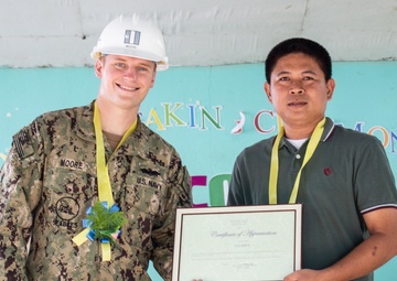 NMCB-5 attends the Sama Sama Children's Learning Center groundbreaking ceremony at Kamuing Elementary School in Palawan, Philippines