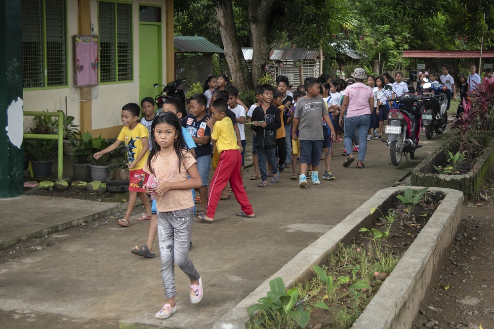 NMCB-5’s Detail Palawan celebrate at the ground breaking ceremony at Malatgao Elementary School