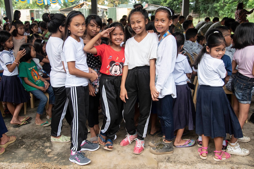 NMCB-5’s Detail Palawan celebrate at the ground breaking ceremony at Malatgao Elementary School