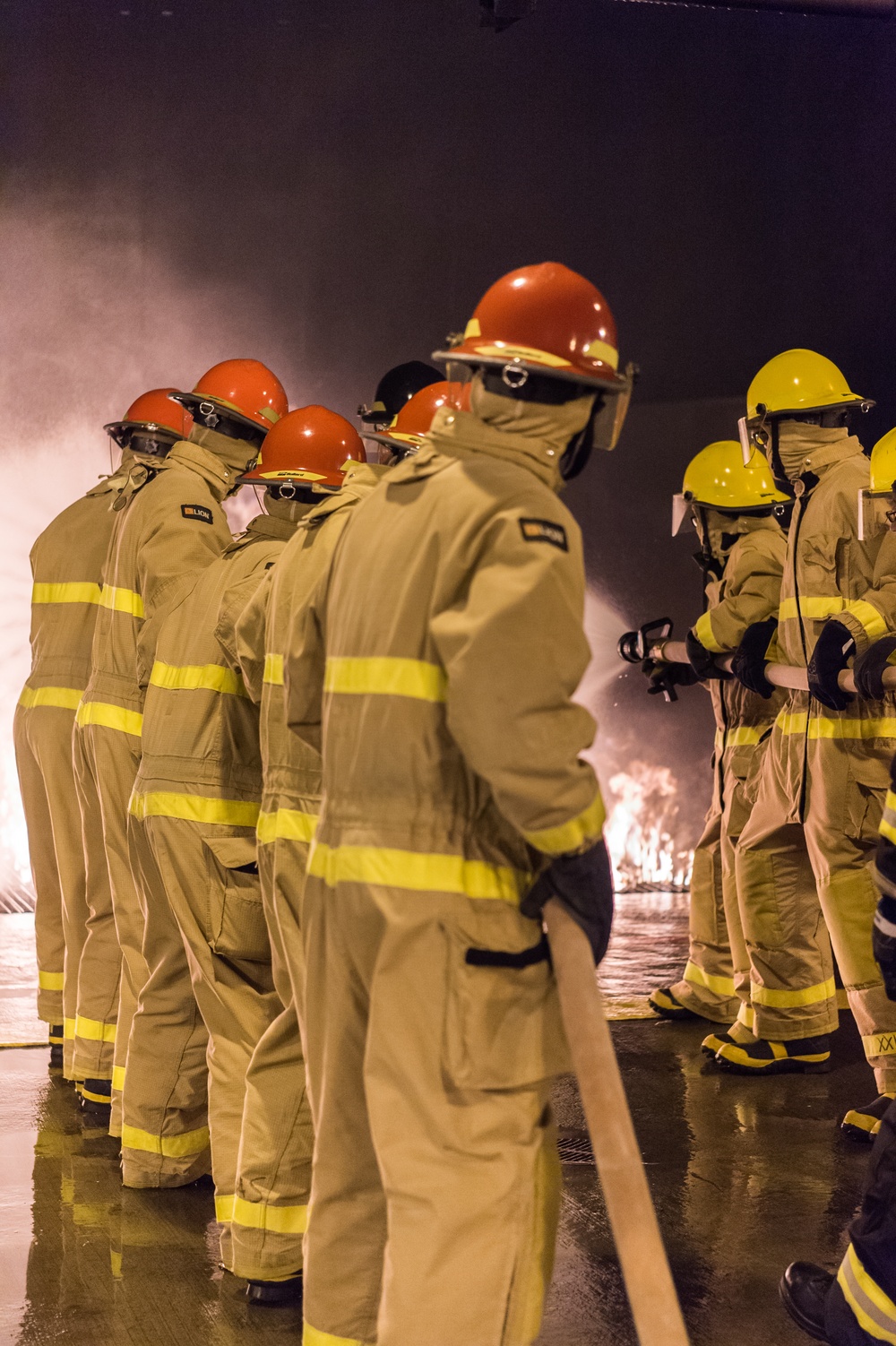 191024-N-TE695-0012 NEWPORT, R.I. (Oct. 24, 2019) -- Navy Officer Candidate School class conducts firefighting training