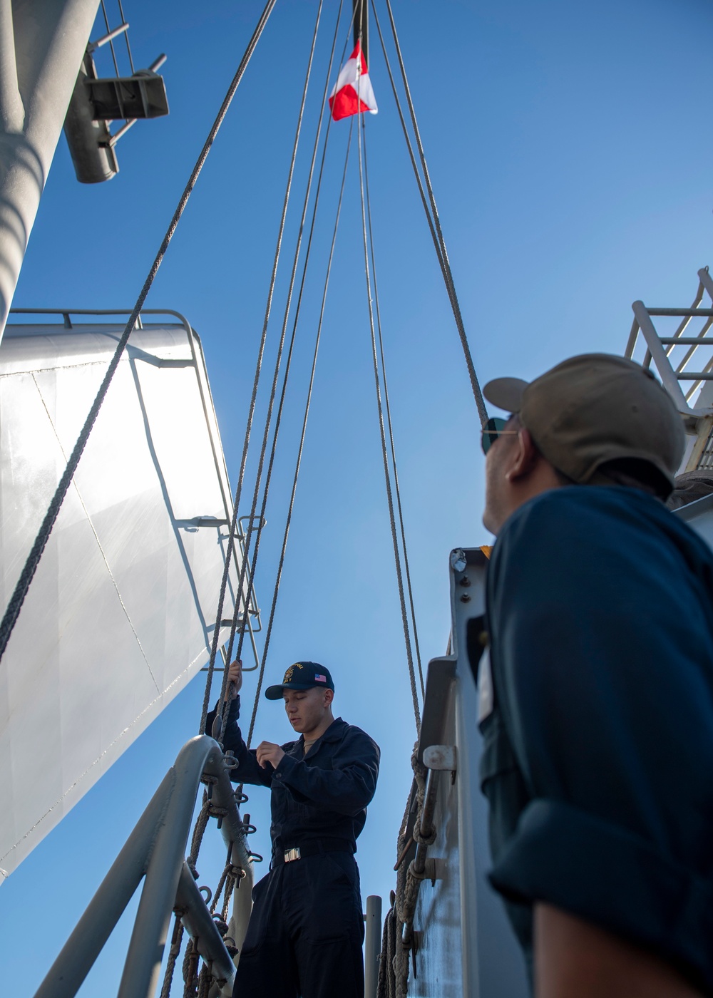 USS Makin Island Quartermasters Hoist Flags