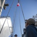 USS Makin Island Quartermasters Hoist Flags