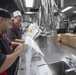 USS McCampbell Sailors prepare meals