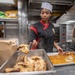 USS McCampbell Sailors prepare meals