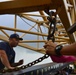 Coast Guard crews maintain equipment aboard the Smilax