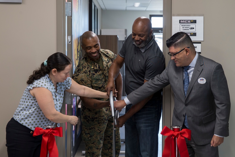 Marines, civilians celebrate mini mart opening at comm facility