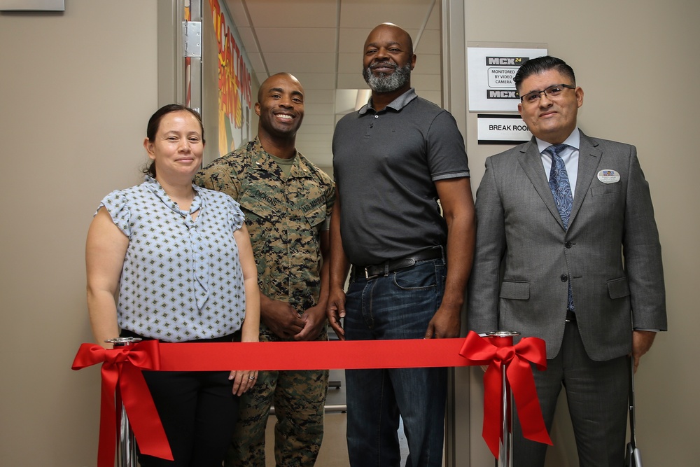 Marines, civilians celebrate mini mart opening at comm facility