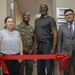 Marines, civilians celebrate mini mart opening at comm facility