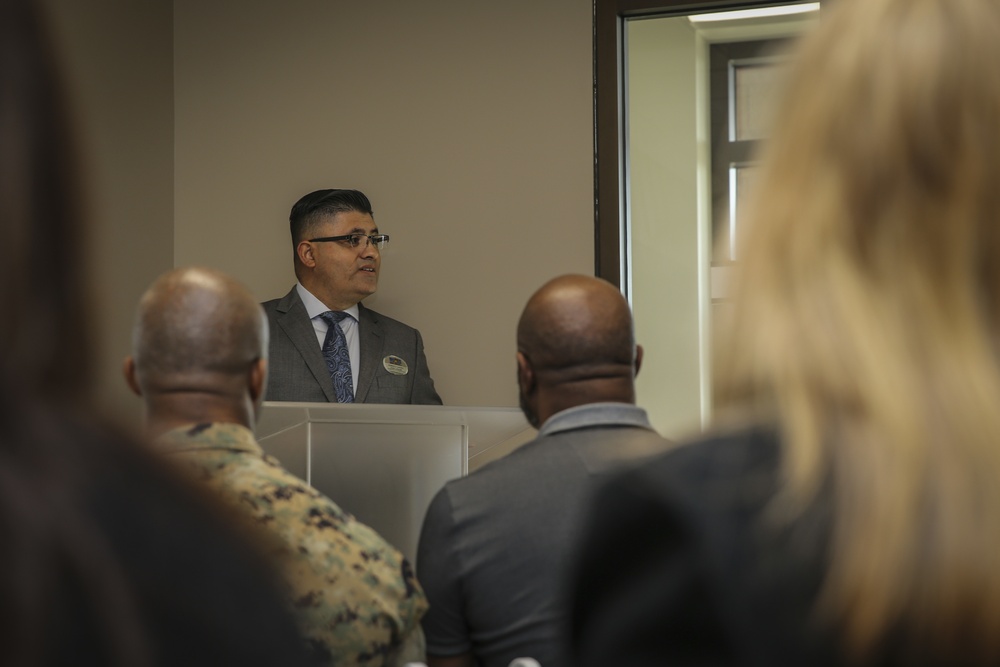 Marines, civilians celebrate mini mart opening at comm facility