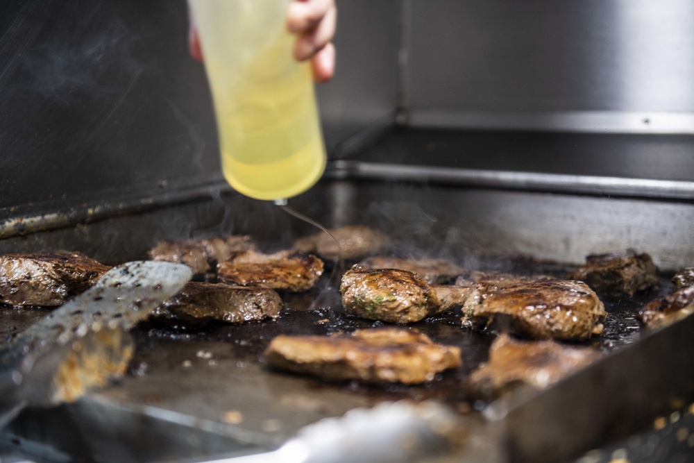 Sailors Aboard USS Milius (DDG 69) Prepare Dinner in the Wardroom Galley