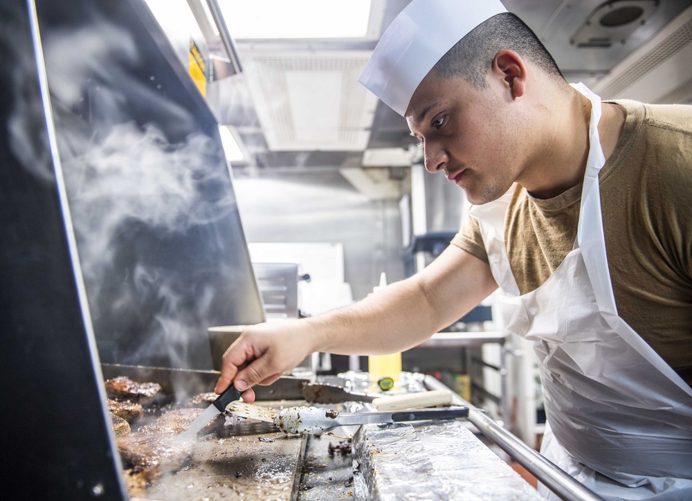 Sailors Aboard USS Milius (DDG 69) Prepare Dinner in the Wardroom Galley