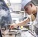 Sailors Aboard USS Milius (DDG 69) Prepare Dinner in the Wardroom Galley