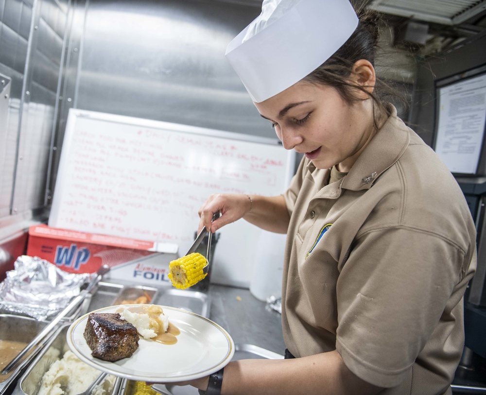 Sailors Aboard USS Milius (DDG 69) Prepare Dinner in the Wardroom Galley