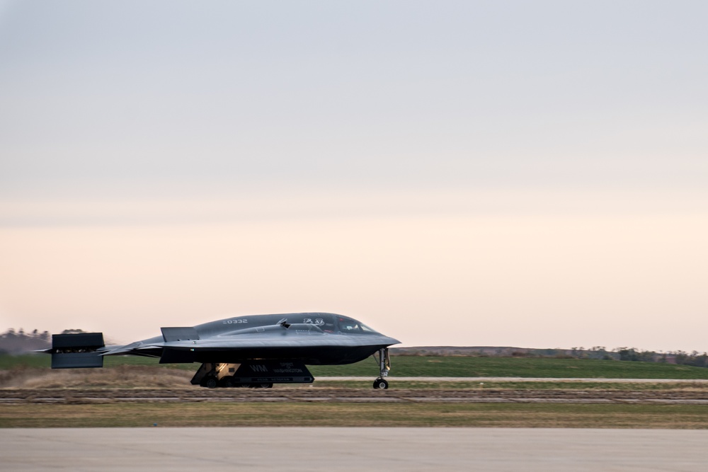A B-2 Spirit Stealth Bomber from Whiteman AFB lands on an airfield