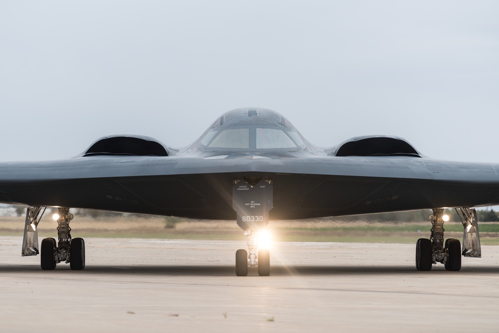 A B-2 Spirit Stealth Bomber from Whiteman AFB taxis down a flight line
