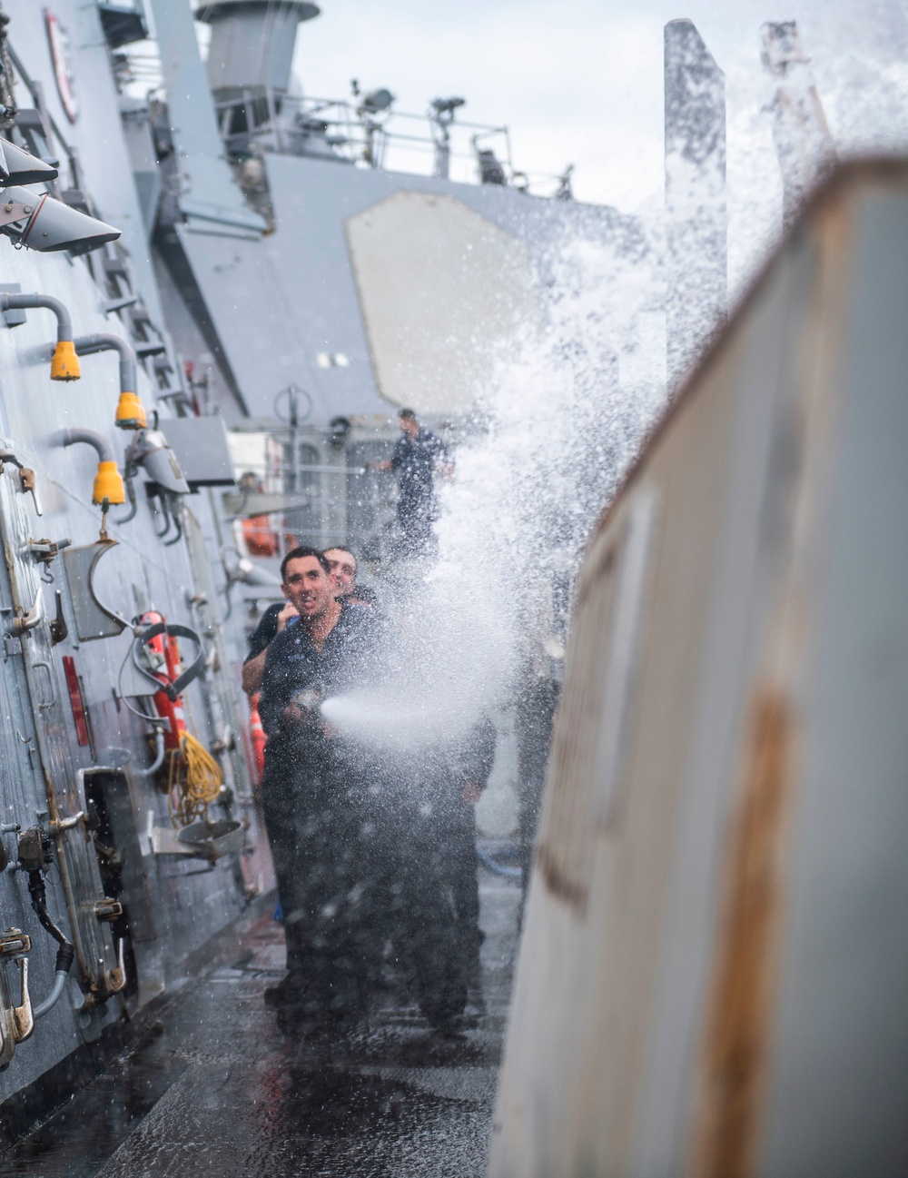 Sailors Aboard USS Milius (DDG 69) Participate in a Fresh Water Wash-down