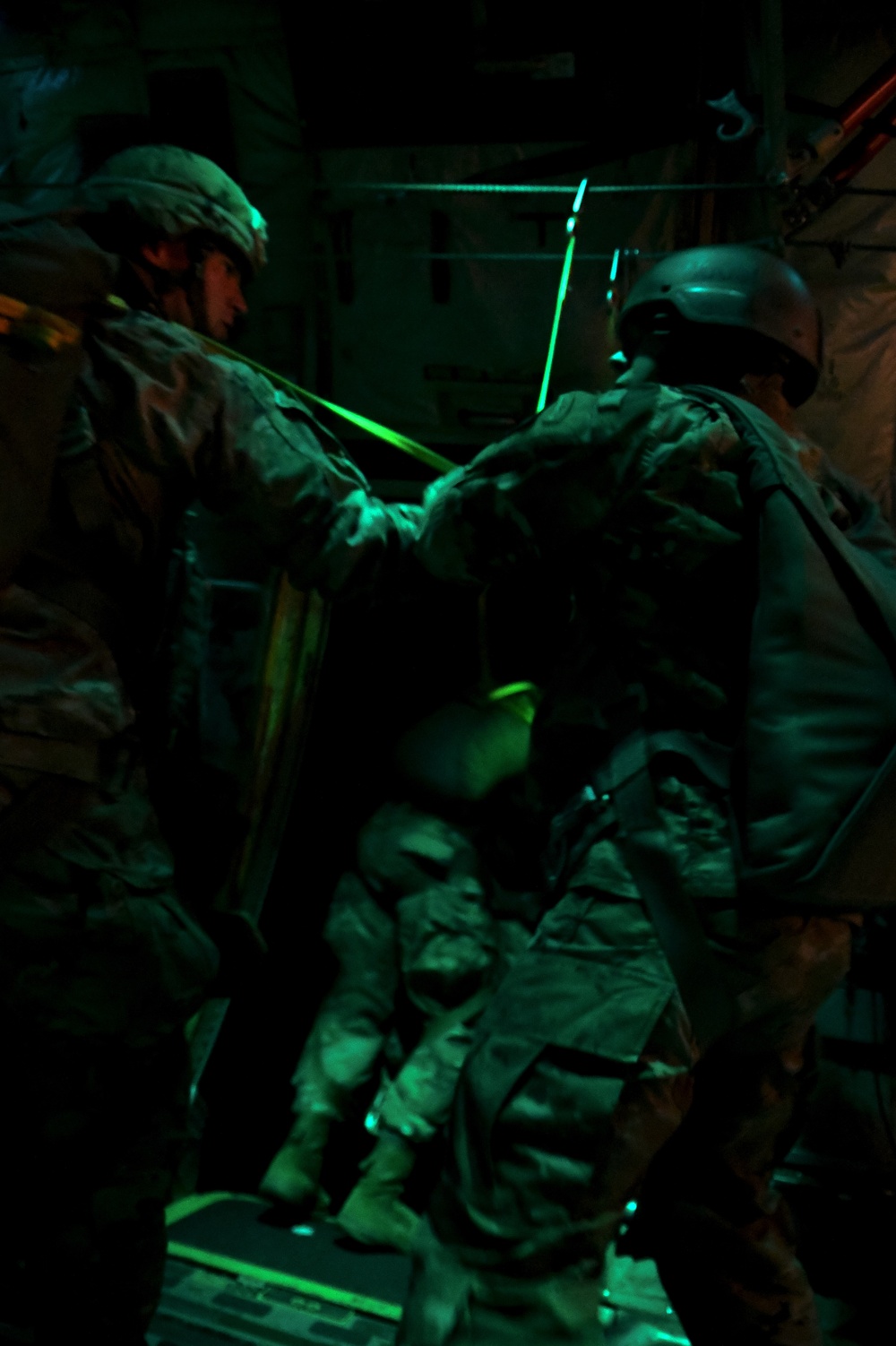 The 143d Airlift Wing, 1/143d Charlie Co. Infantry Airborne, Team Up for High Performance Tactical Night Jump Training