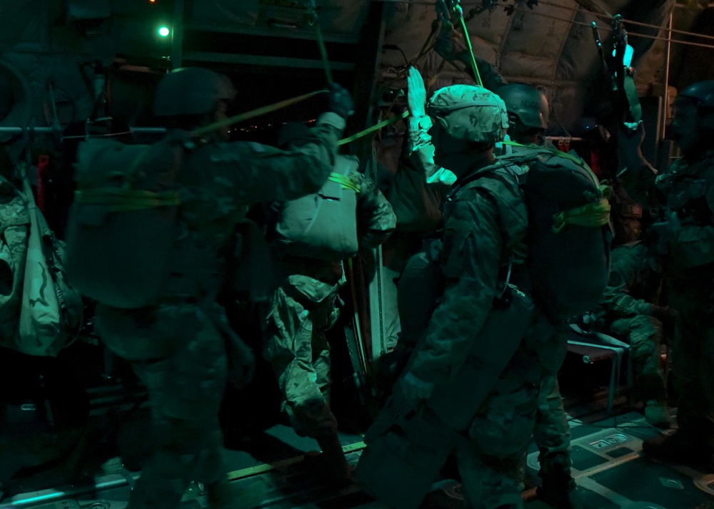 The 143d Airlift Wing, 1/143d Charlie Co. Infantry Airborne, Team Up for High Performance Tactical Night Jump Training