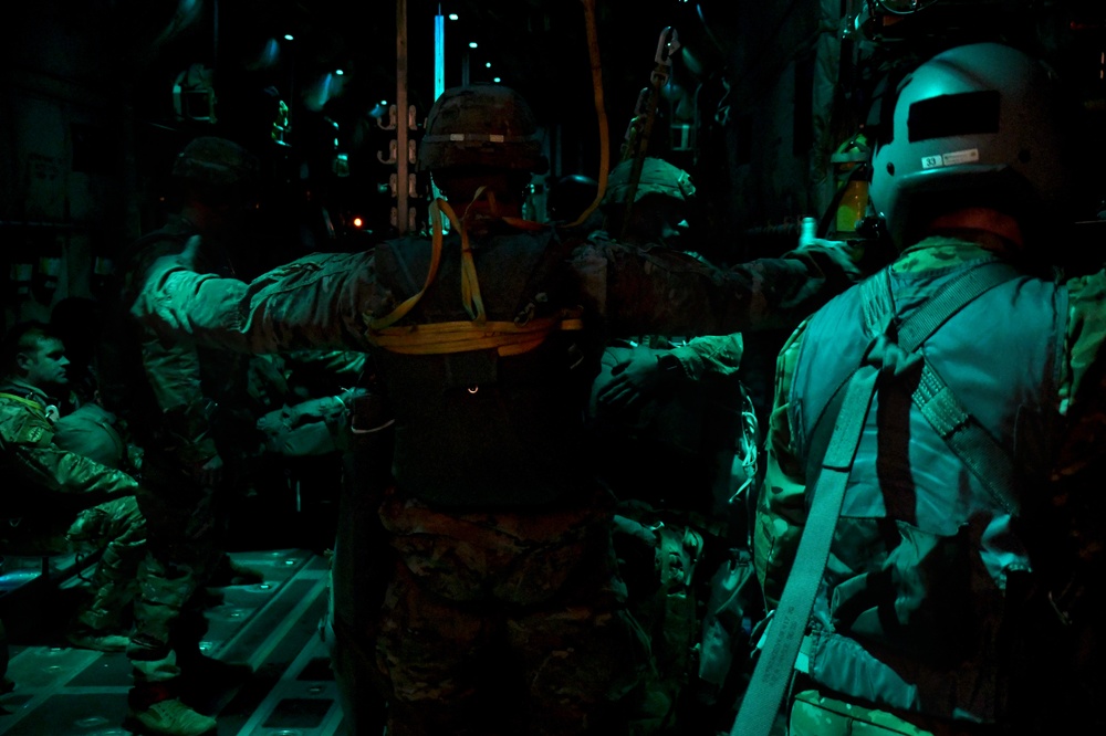 The 143d Airlift Wing, 1/143d Charlie Co. Infantry Airborne, Team Up for High Performance Tactical Night Jump Training