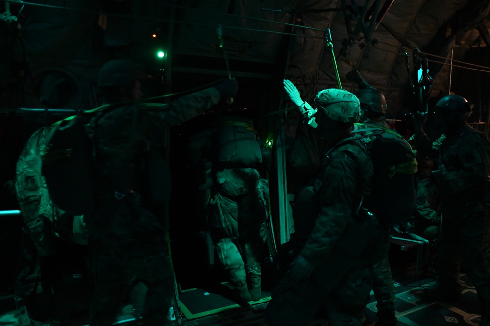 The 143d Airlift Wing, 1/143d Charlie Co. Infantry Airborne, Team Up for High Performance Tactical Night Jump Training