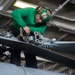 A Sailor conducts maintenance