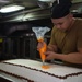 A Sailor prepares cake