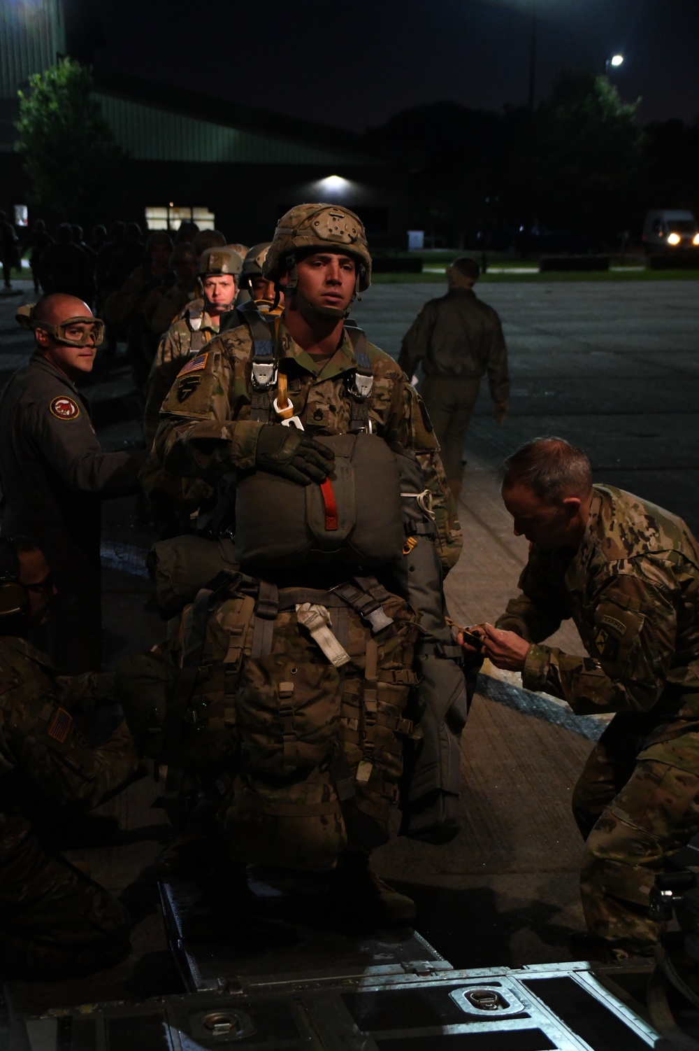 The 143d Airlift Wing, 1/143d Charlie Co. Infantry Airborne, Team Up for High Performance Tactical Night Jump Training