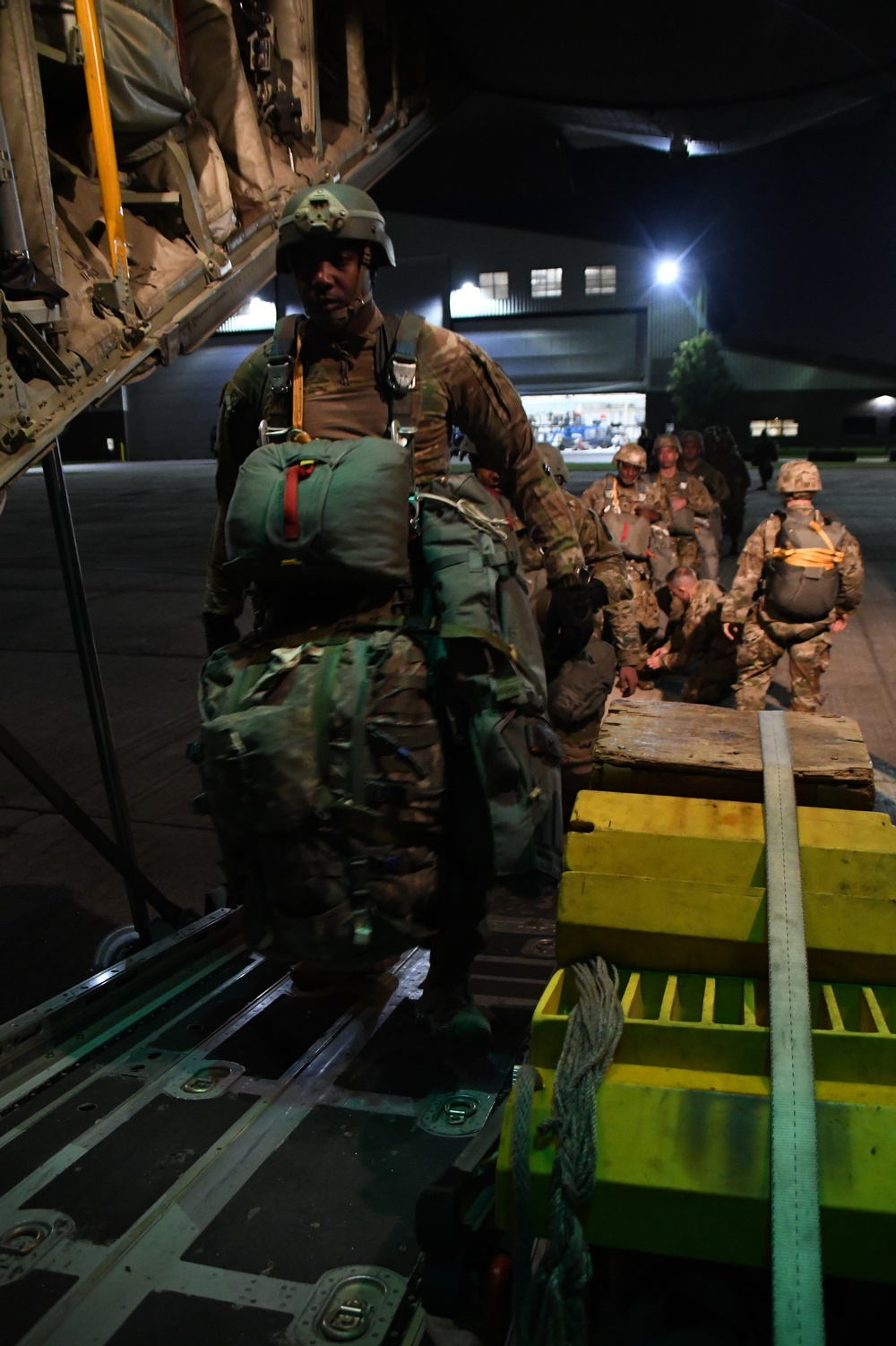 The 143d Airlift Wing, 1/143d Charlie Co. Infantry Airborne, Team Up for High Performance Tactical Night Jump Training