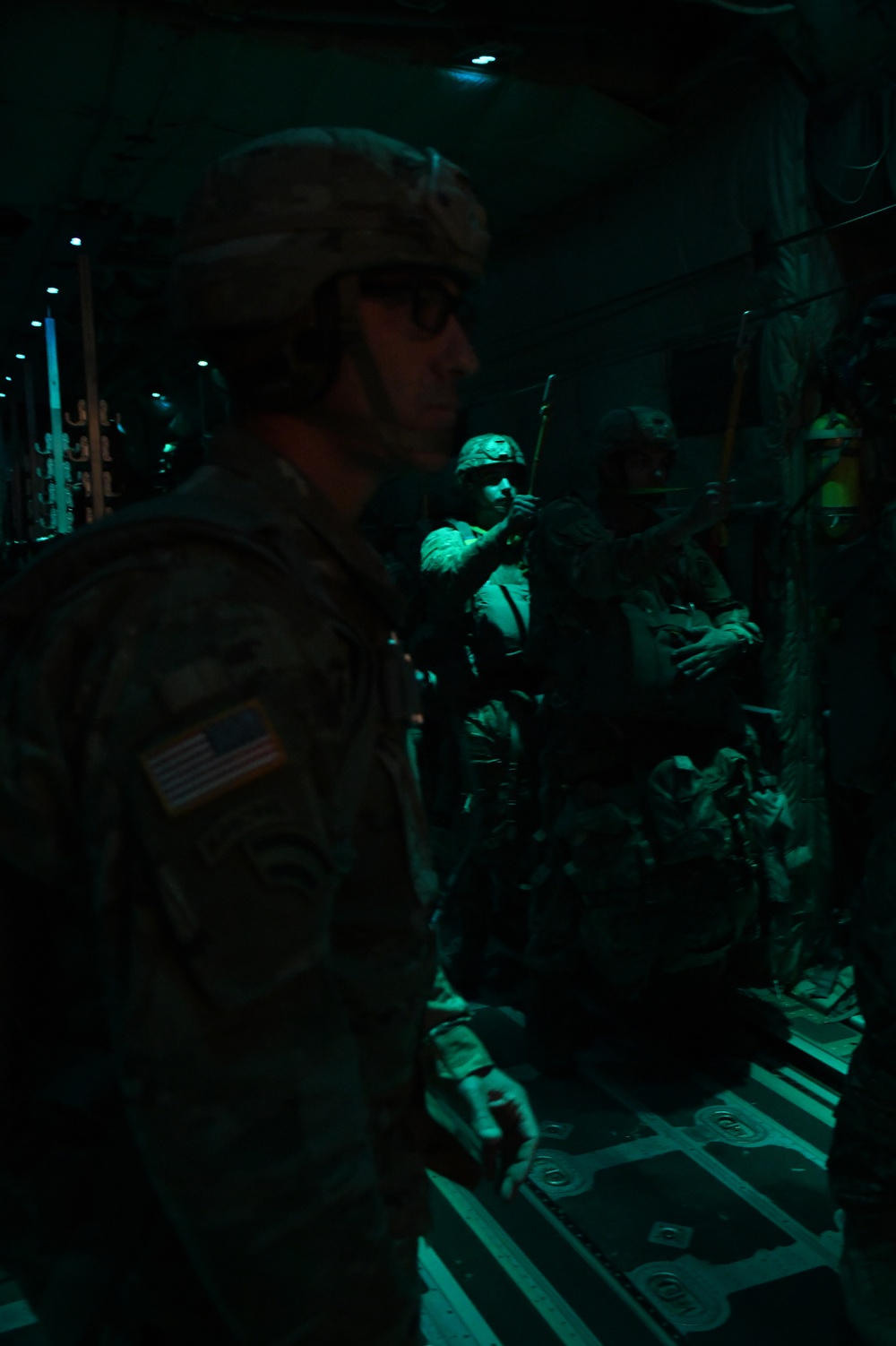 The 143d Airlift Wing, 1/143d Charlie Co. Infantry Airborne, Team Up for High Performance Tactical Night Jump Training