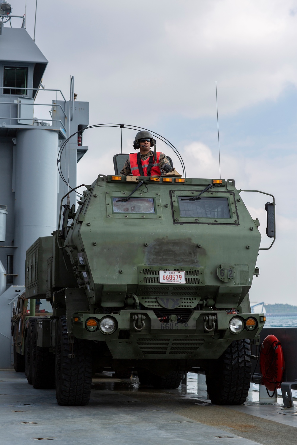 U.S. Marine High Mobility Artillery Rocket System embarks on Army landing craft