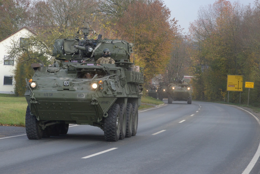 Soldiers driving Stryker armored vehicles 