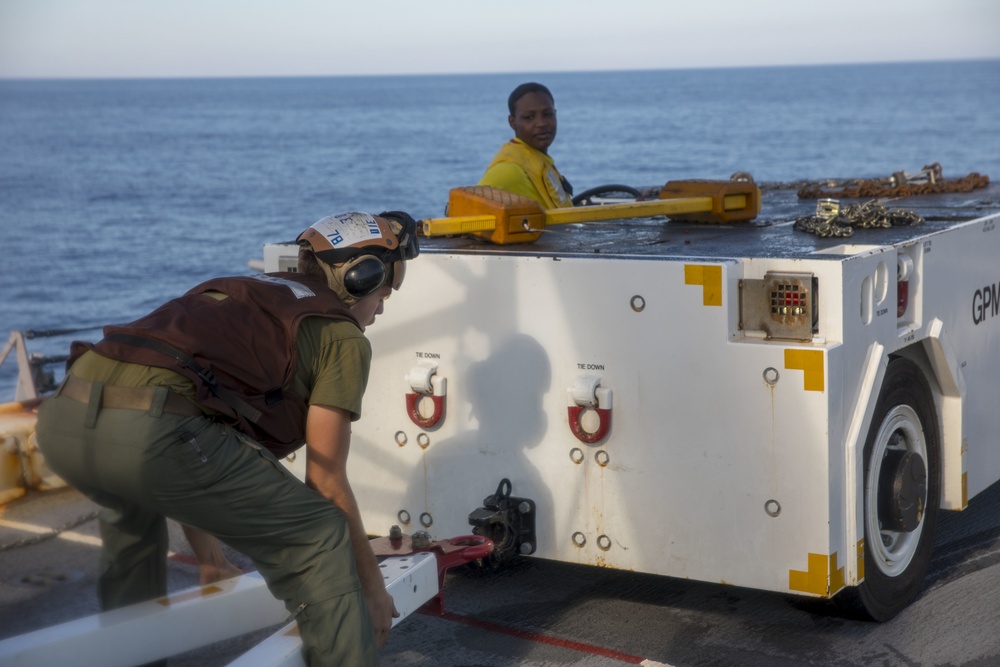 Sailor and Marine attach tow tractor to tow bar