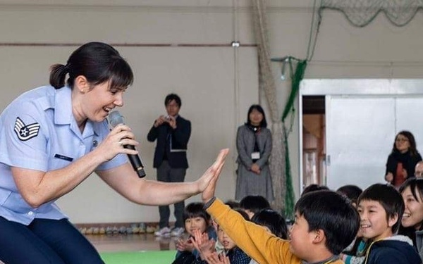 Hi Five-ing School Student