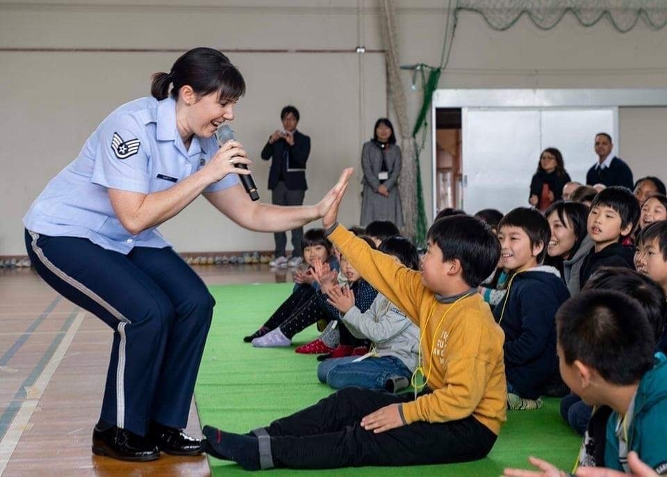 Hi Five-ing School Student
