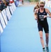 Coyle finishes triathlon for gold