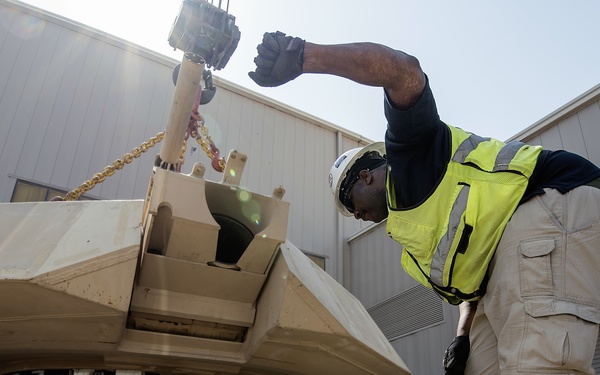 Directing the crane to attach a turret