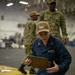 U.S. Navy Hospital Corpsman 3rd Class Emily Pierce, from Bremerton, Washington, checks on a simulated patient during a mass casualty drill