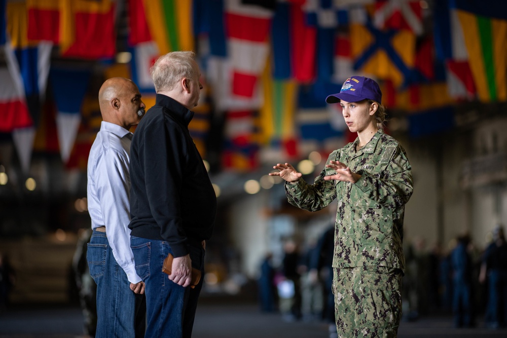 U.S. Sailor leads a tour