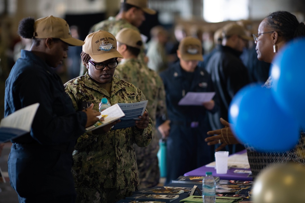 U.S. Sailors attend an education fair