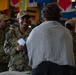 U.S. Navy Aviation Boatswain's Mate (Equipment) 3rd Class Kierra Rozier, from Atlanta, attends an education fair.