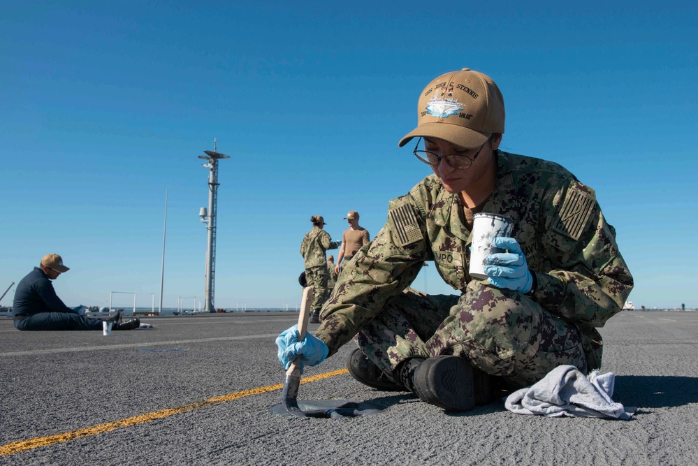 U.S. Sailor paints padeye